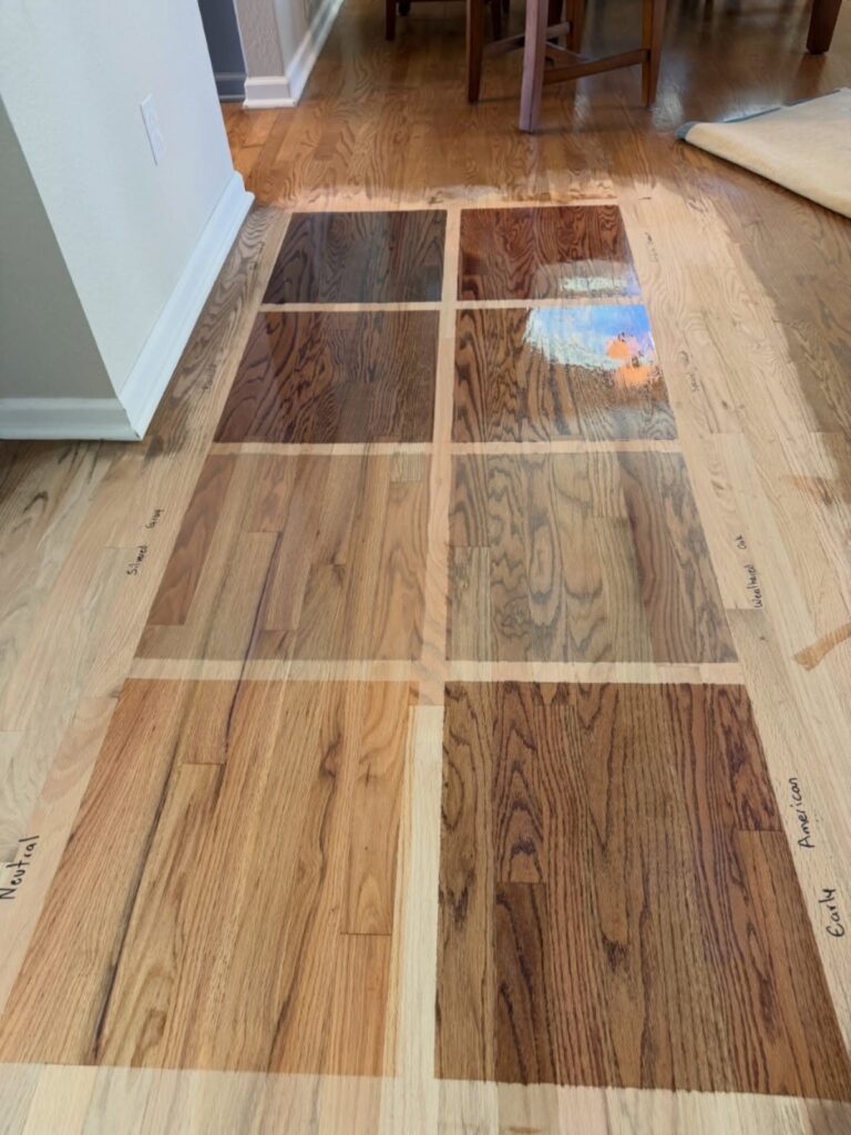 Wooden floor samples showing various stain colors for comparison and color matching.